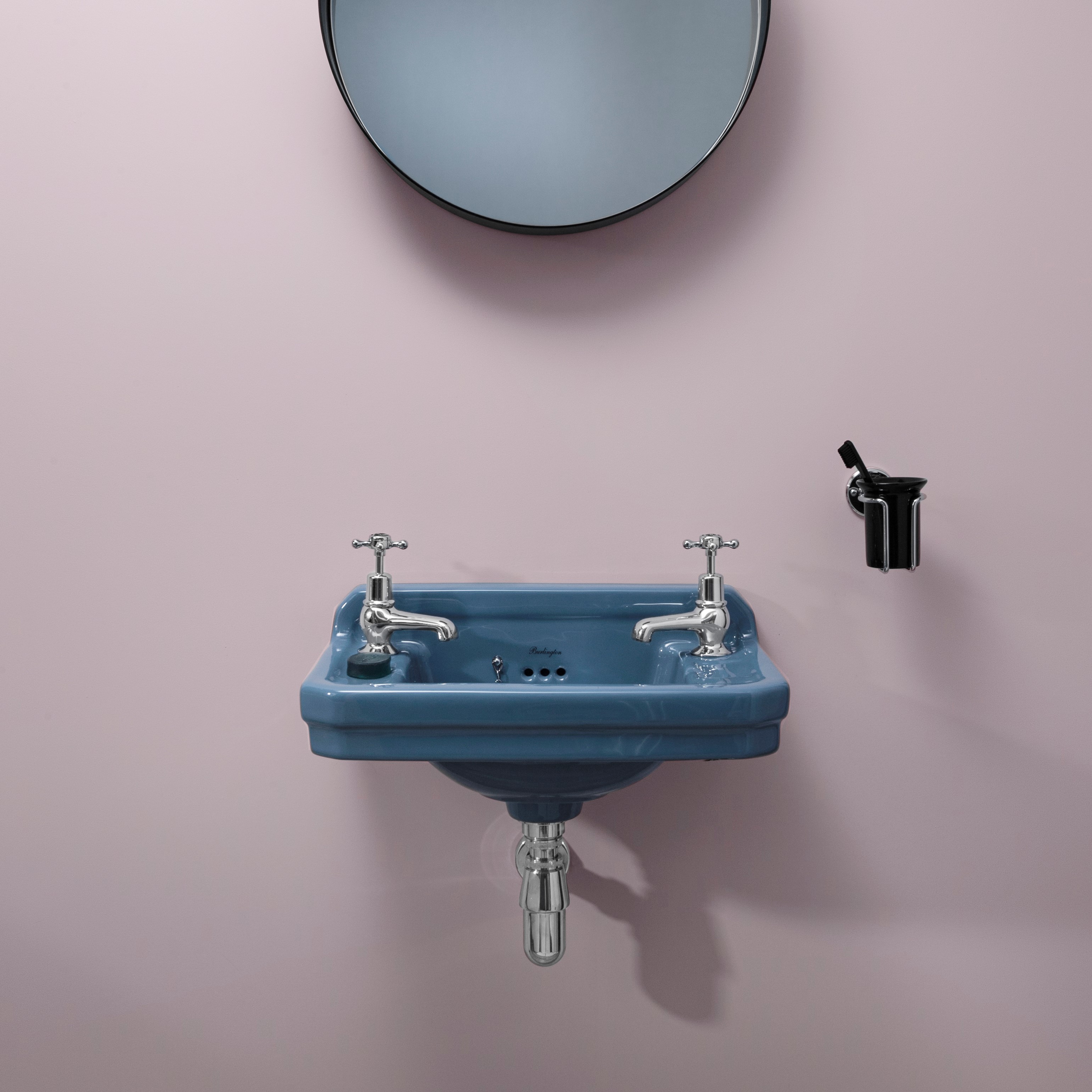 This traditional Edwardian basin in Alaska Blue coupled with a bright, modern pink wall creates a stunning bathroom design that is the perfect mix of traditional and modern. Edwardian Cloakroom Basin in Alaska Blue