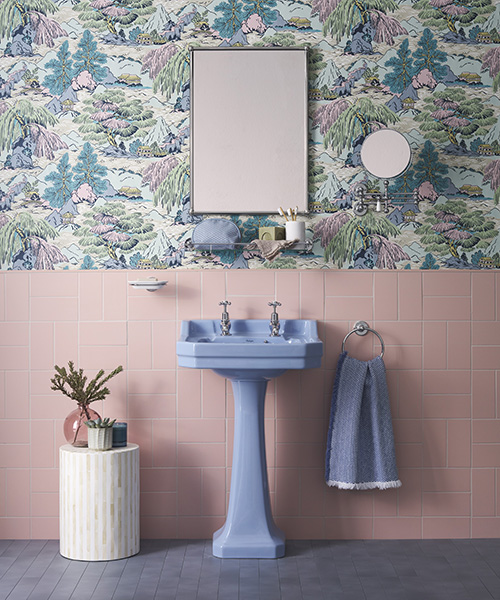This colourful bathroom design shows the essence of dopamine decor through the use of a striking green basin against a green and pink wall. Bespoke by Burlington Alaska Blue bathroom ceramics